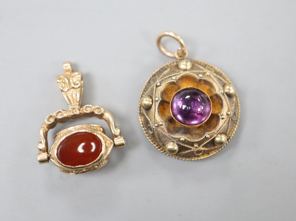 A Victorian yellow metal and cabochon amethyst set pendant, 20mm and a modern 9ct gold and gem set fob, gross 8.6 grams.